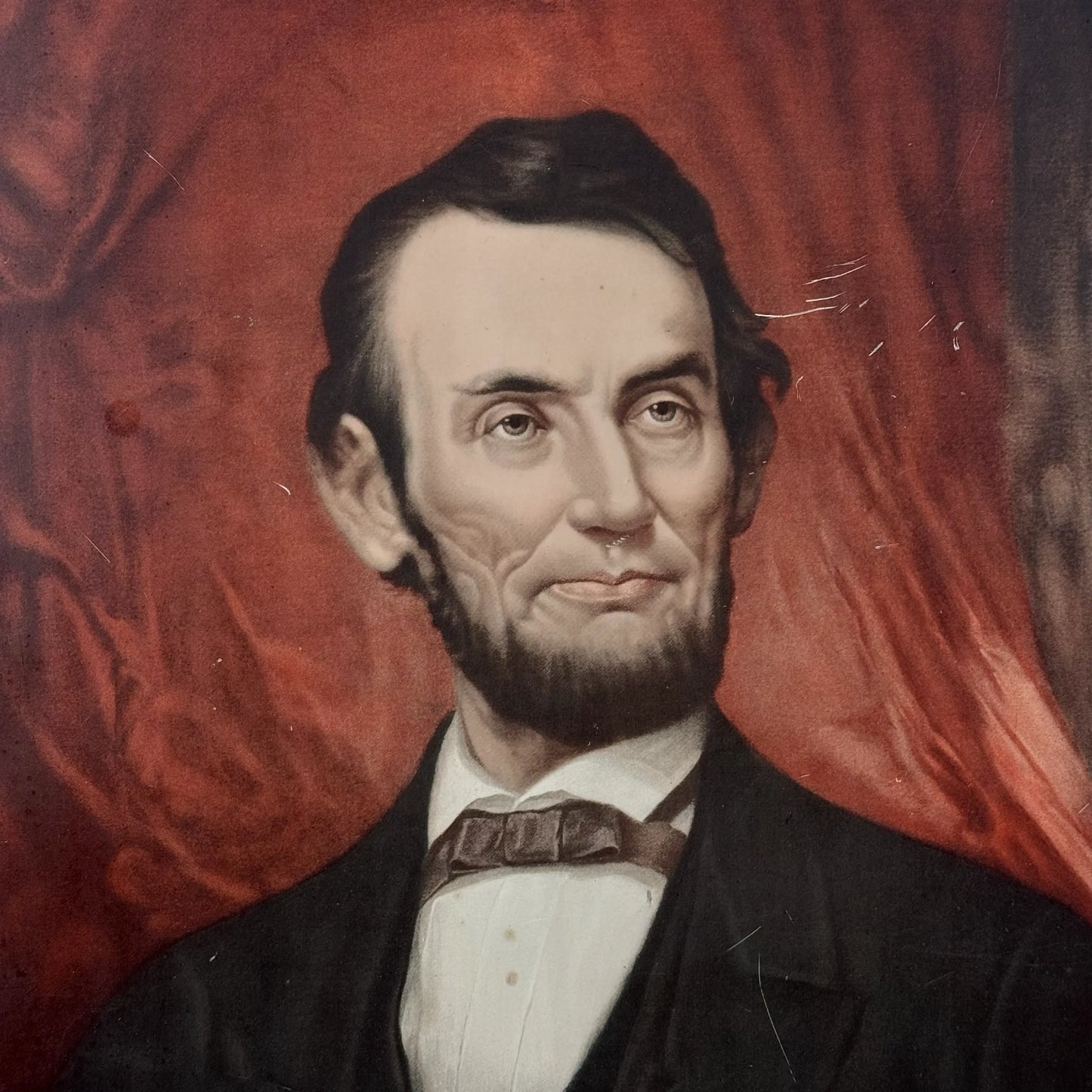 Baked tin chromite lithograph of George Henry Story's painting of Lincoln — 1931