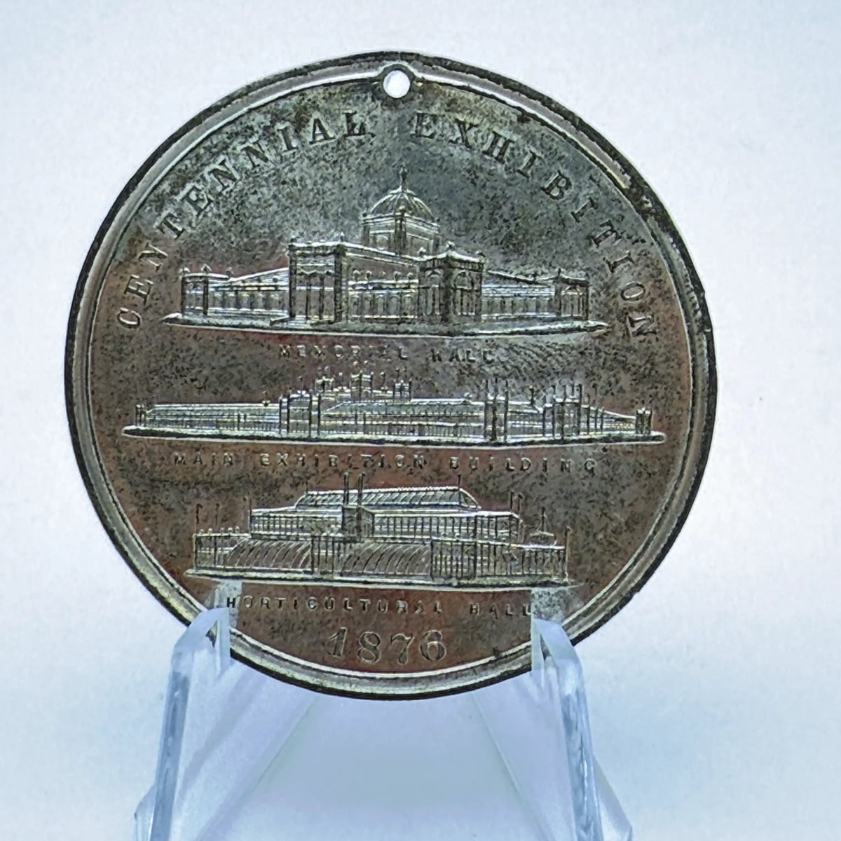Four medals made for the Centennial International Exhibition — 1876