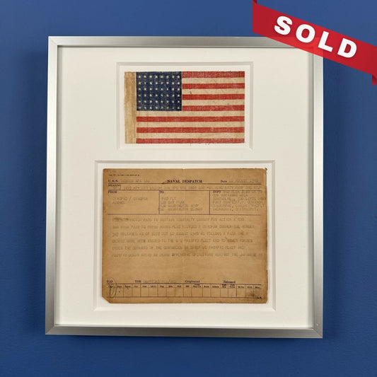 Naval despatch on August 15, 1945, announcing the end of the war in the Pacific, with 48-star flag — matted and framed