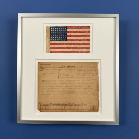 Naval despatch on August 15, 1945, announcing the end of the war in the Pacific, with 48-star flag — matted and framed