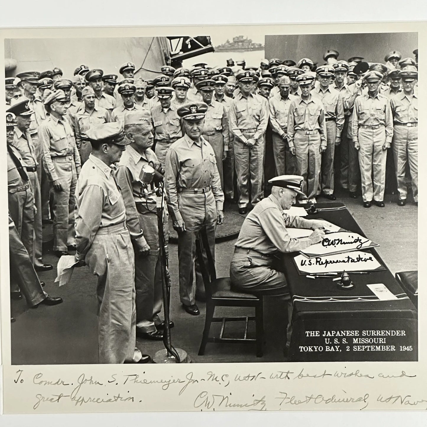 Admiral Chester Nimitz signed photo aboard USS Missouri as he is signing the surrender documents — September 2, 1945