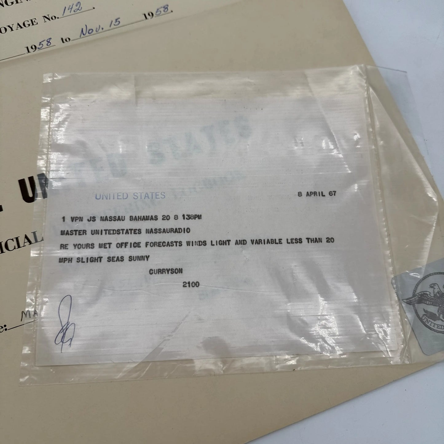 SS United States place setting with book, documents, stock certificate
