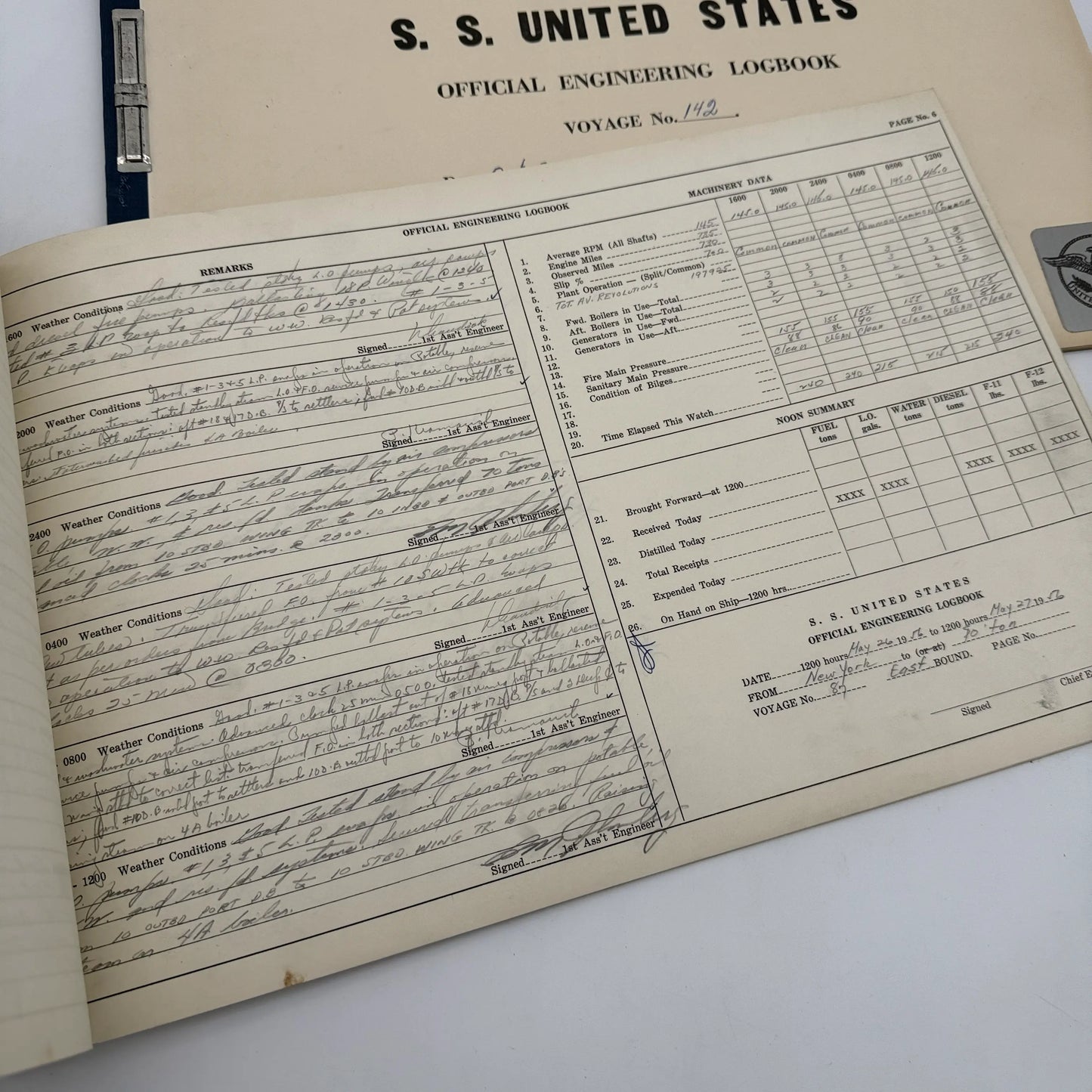 SS United States place setting with book, documents, stock certificate
