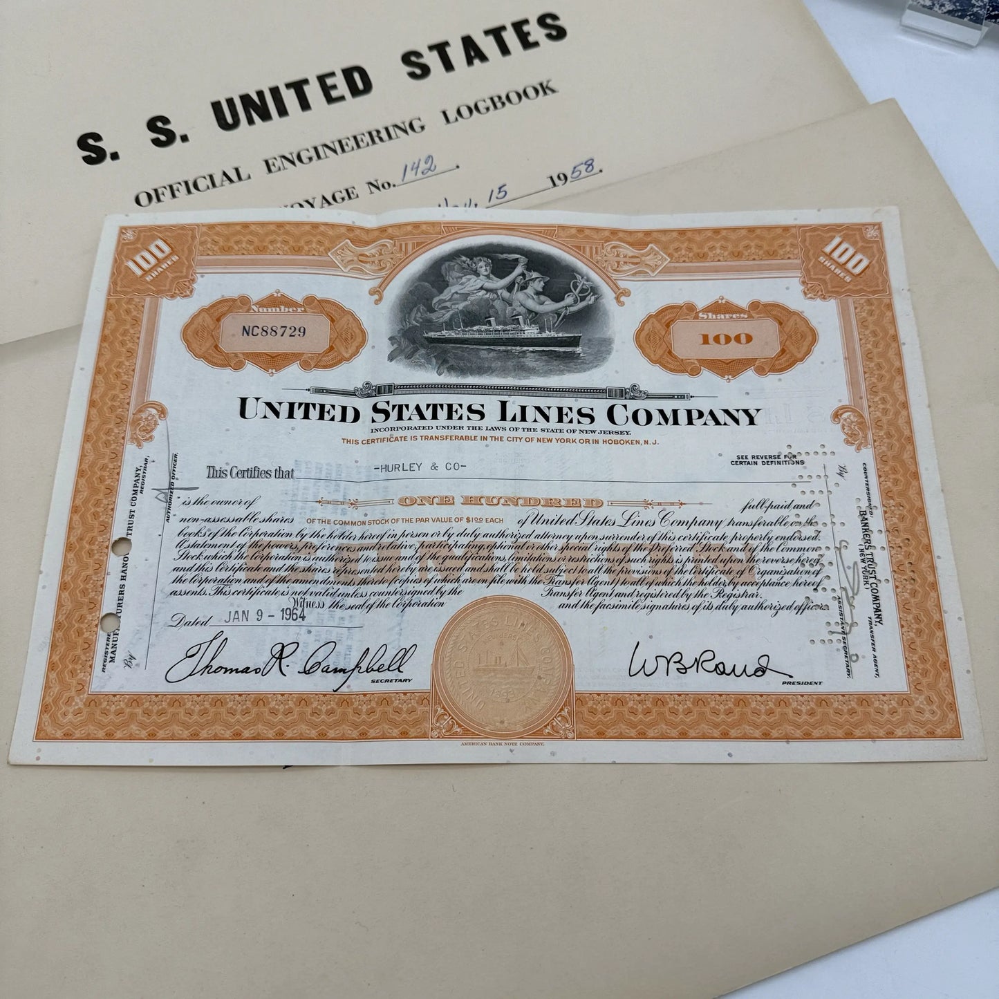 SS United States place setting with book, documents, stock certificate