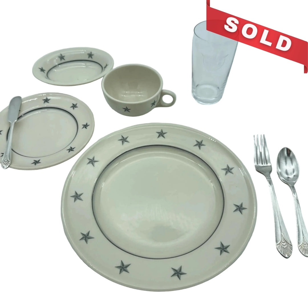 SS United States place setting with book, documents, stock certificate