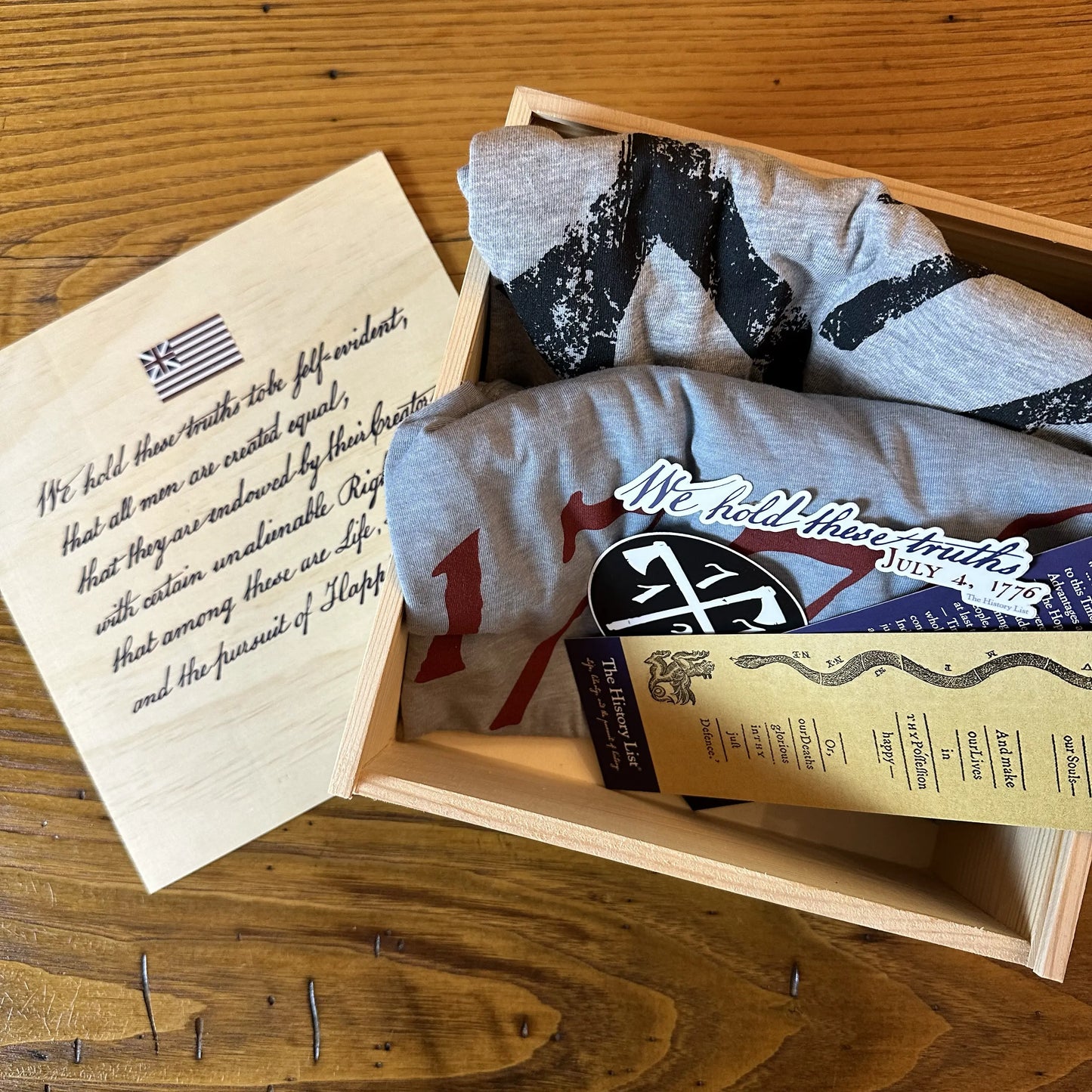 Revolutionary War gift box with our "1773" and "1776" shirts and bookmarks and stickers from The History List Store