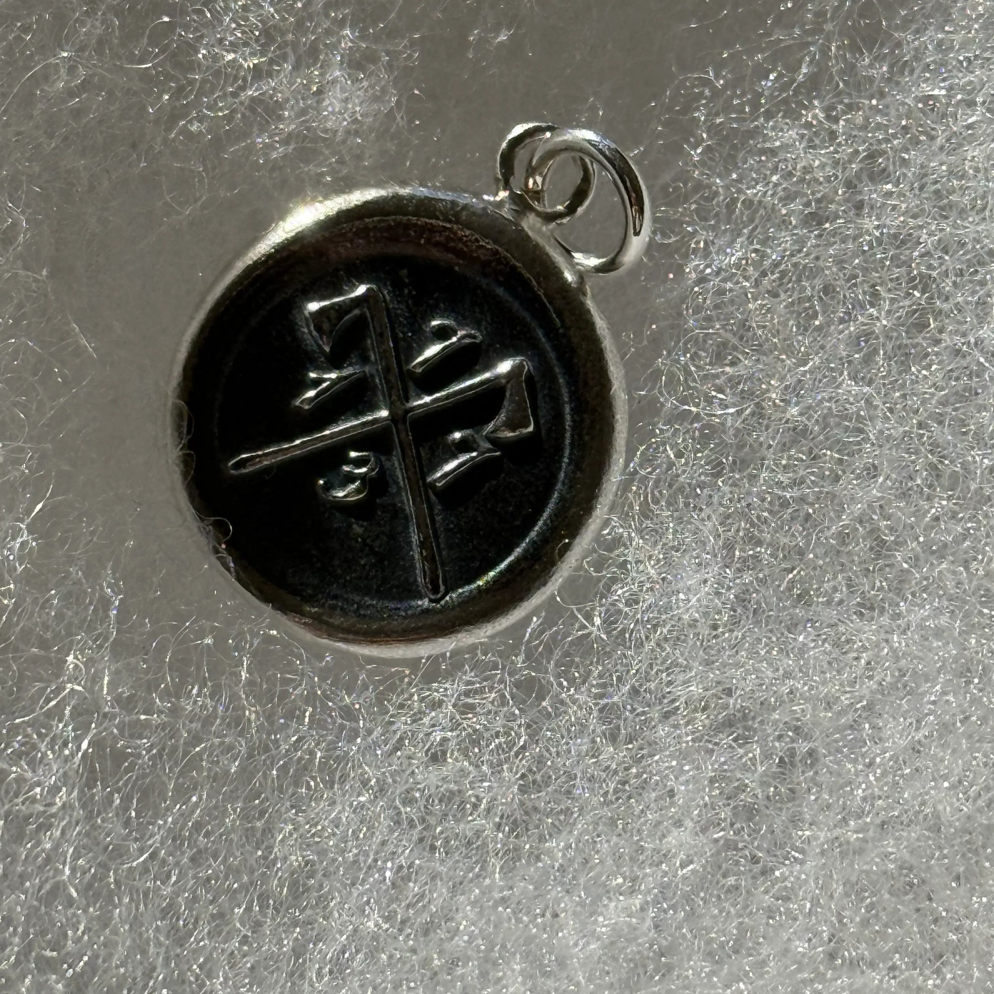 Close up of the 1773 Revolutionary sterling silver charms made by hand in New England from The History List Store.