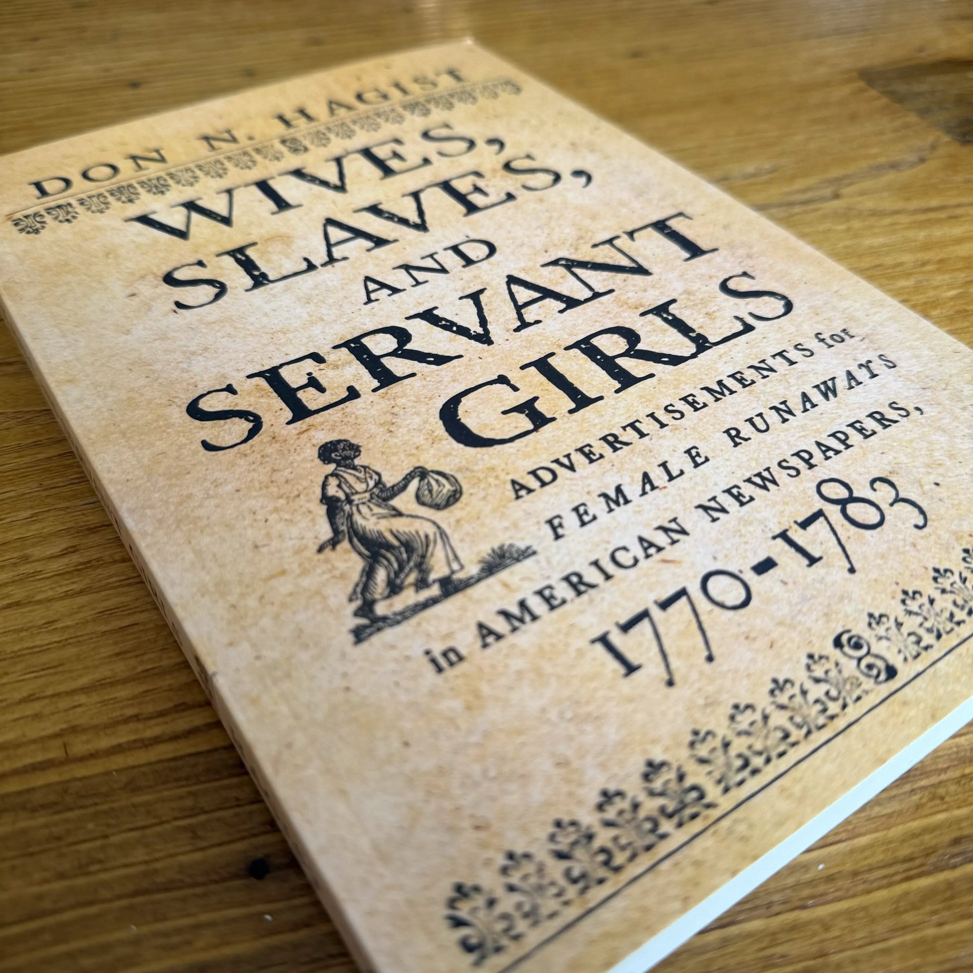 Close up of "Wives, Slaves, and Servant Girls: Advertisements for Female Runaways in American Newspapers, 1770–1783" - Signed by the Author, Don N. Hagist