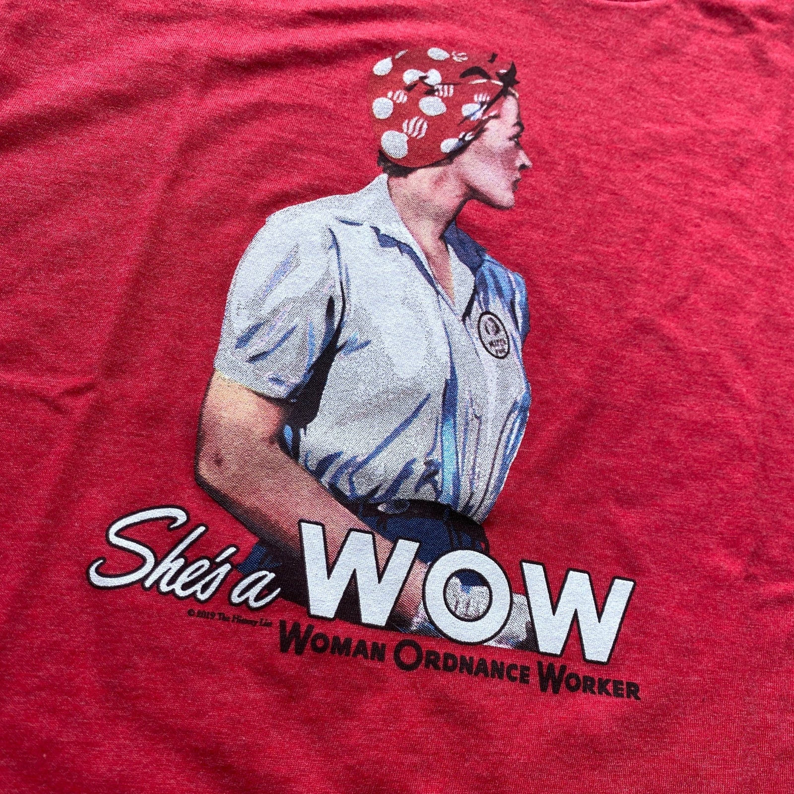 Close-up of "She's a W.O.W." V-neck shirt from The History List store