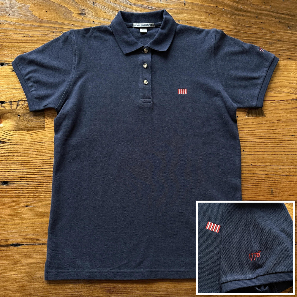 Front view of the "Sons of Liberty" 1776 Polo shirt in Dark Grey from The History List Store.