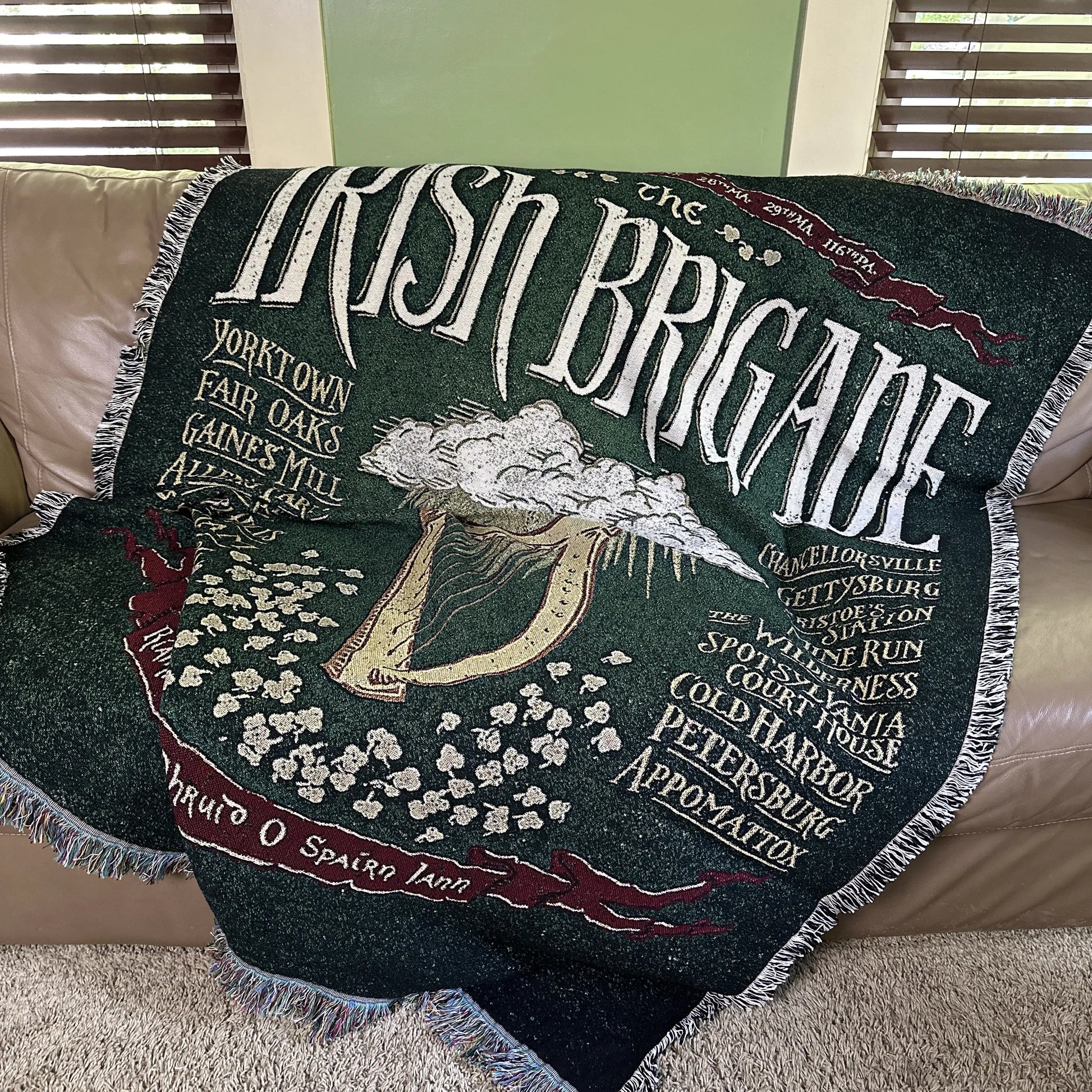 The Civil War "Irish Brigade" woven blanket — Made in America from The History List store on the couch