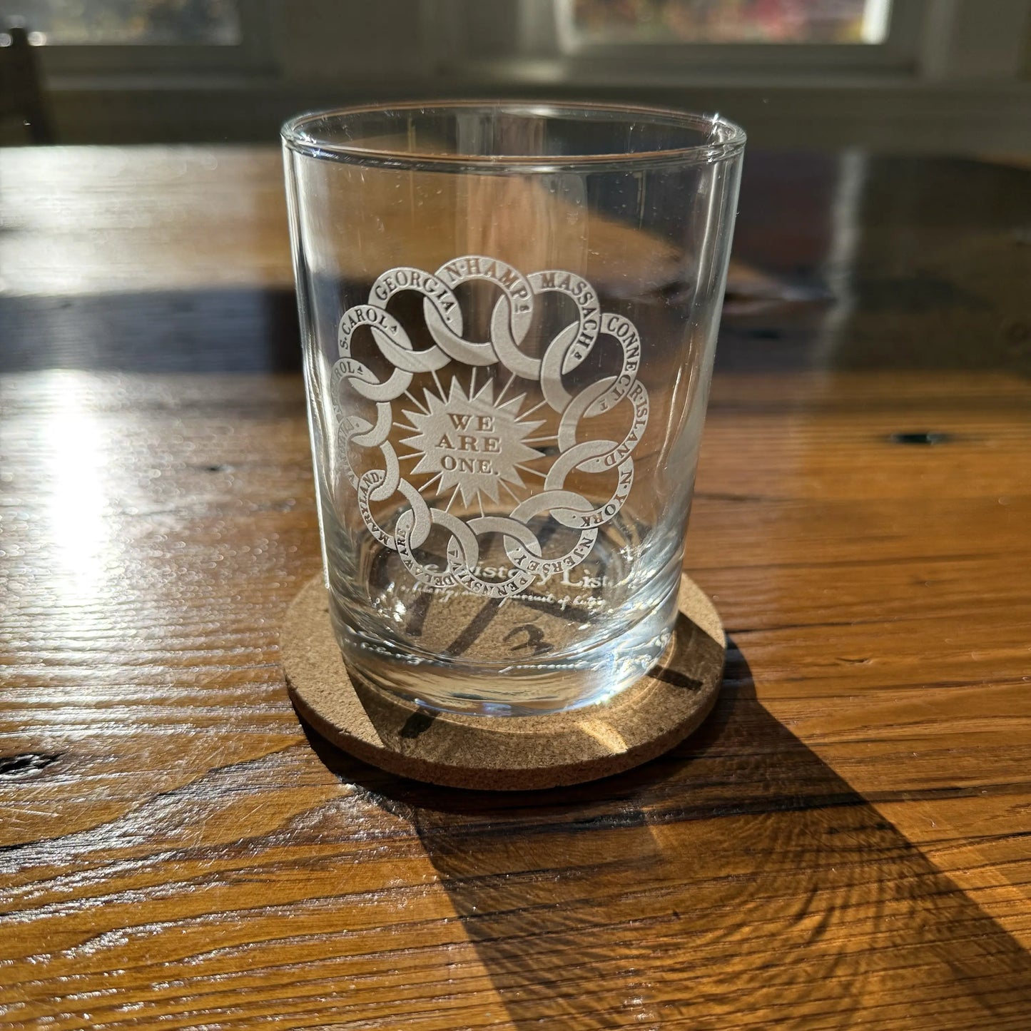 Close up details of the “We are one” Rock glasses and cork coaster — Made in America from The History List Store.