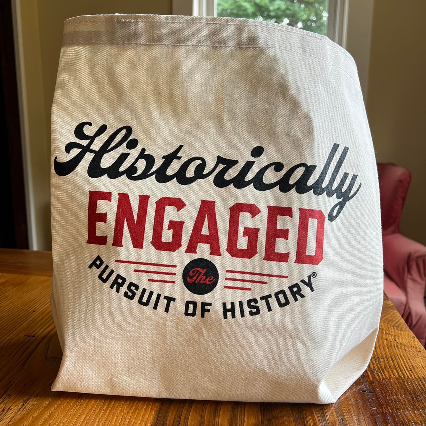 Historically Engaged Tote Bag on tabletop