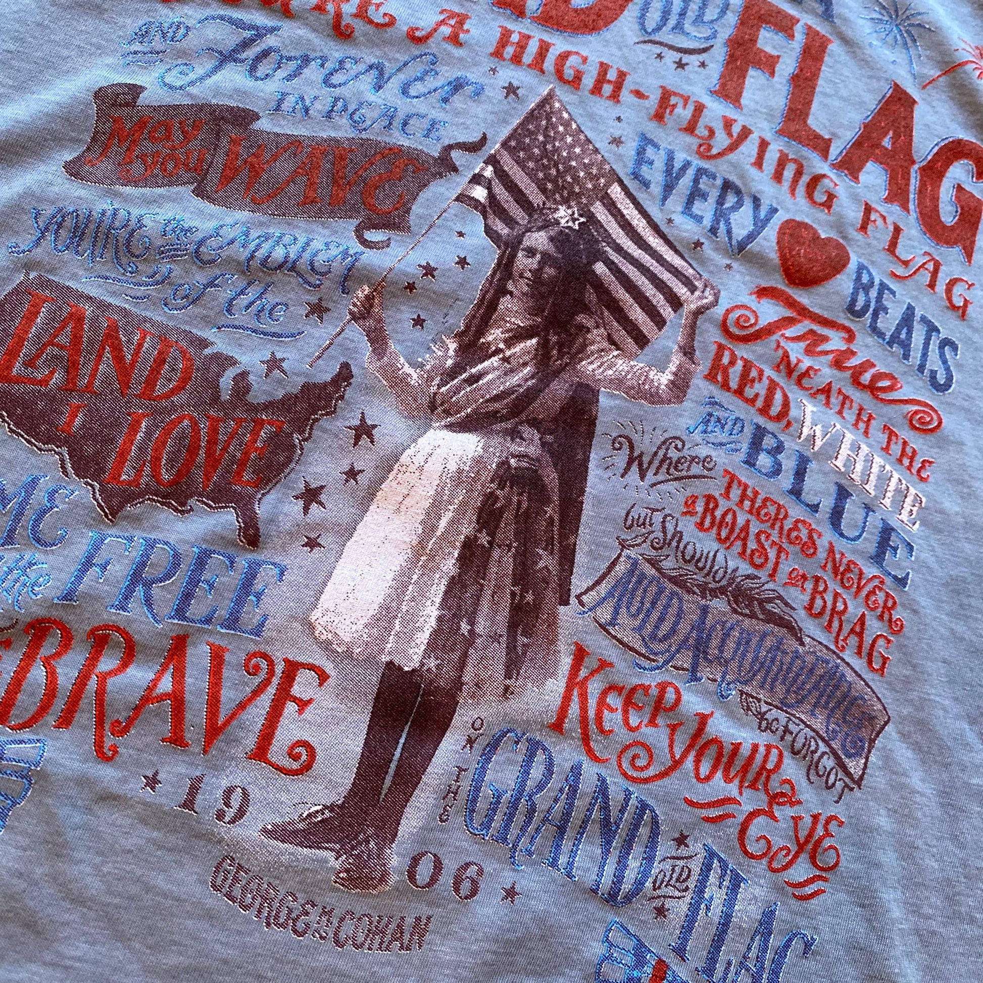 Close-up of back of "Grand Old Flag" V-neck shirt from The History List store