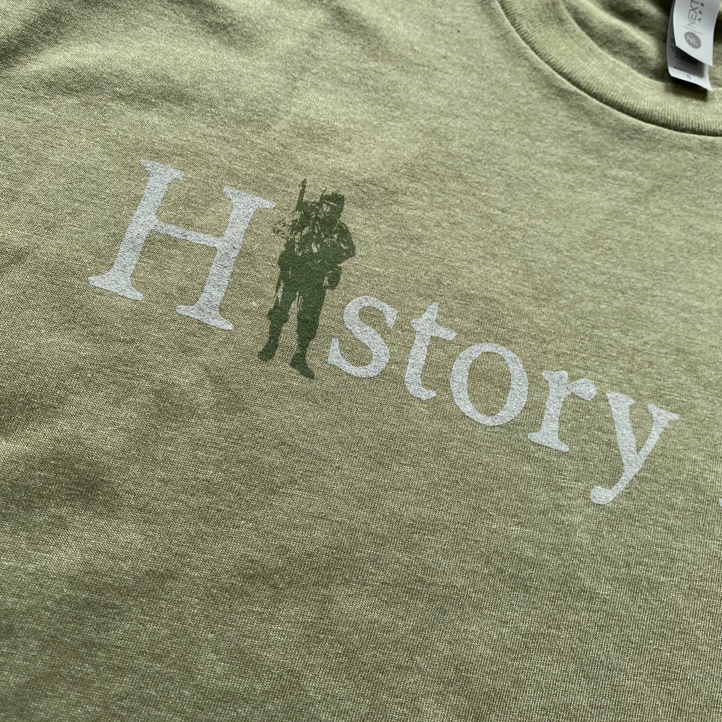 Close-up of "History Nerd" V-neck shirt with a WWII Soldier - Military green from The History List Store