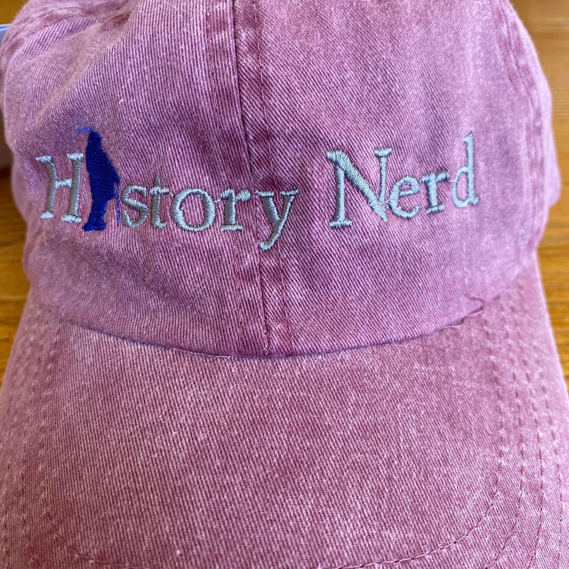 Close-up of the Embroidered "History Nerd" with Ben Franklin cap - Maroon from The History List Store