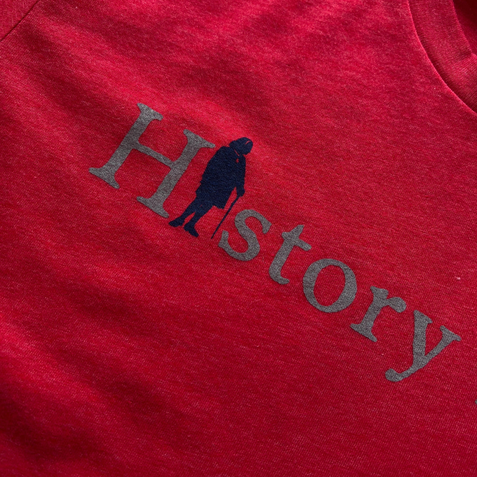 Red close-up of "History Nerd" shirt with Ben Franklin from The History List Store
