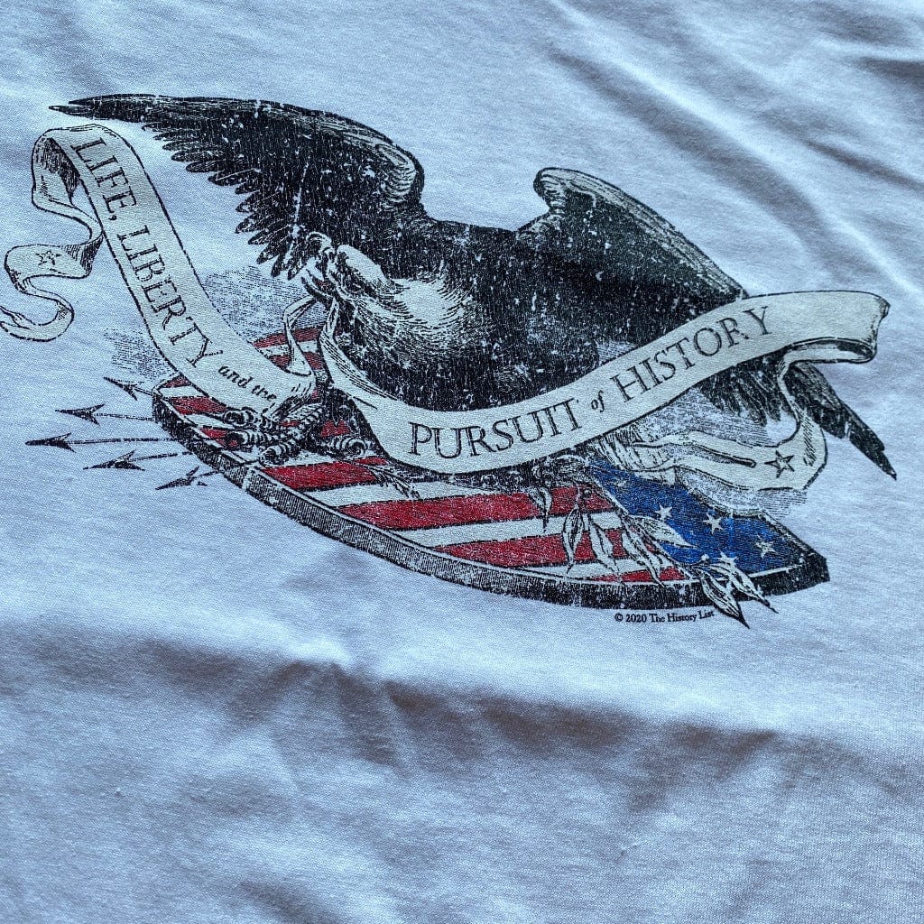Close-up of "Life Liberty, and the Pursuit of History" shirt with Historic Eagle and Shield Engraving from the history list store