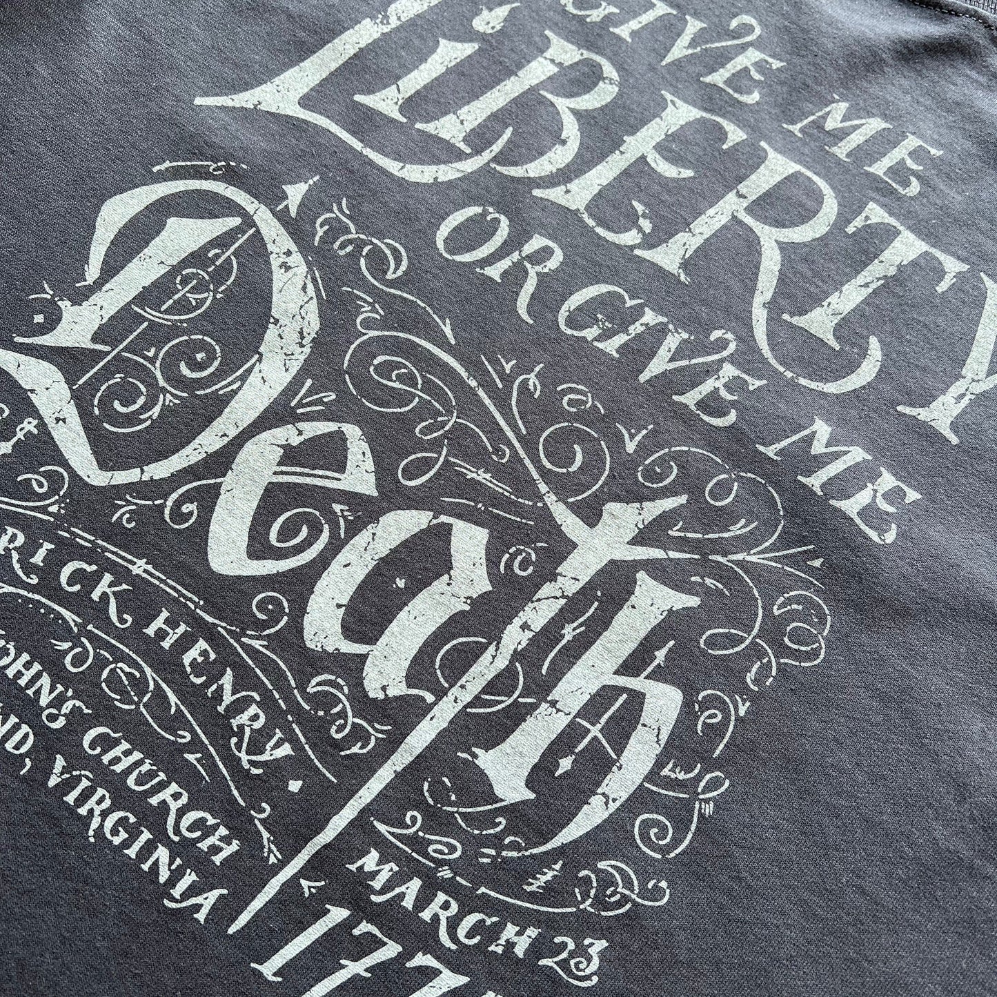 Closeup of "Give me liberty, or give me death!" Shirt from the history list store