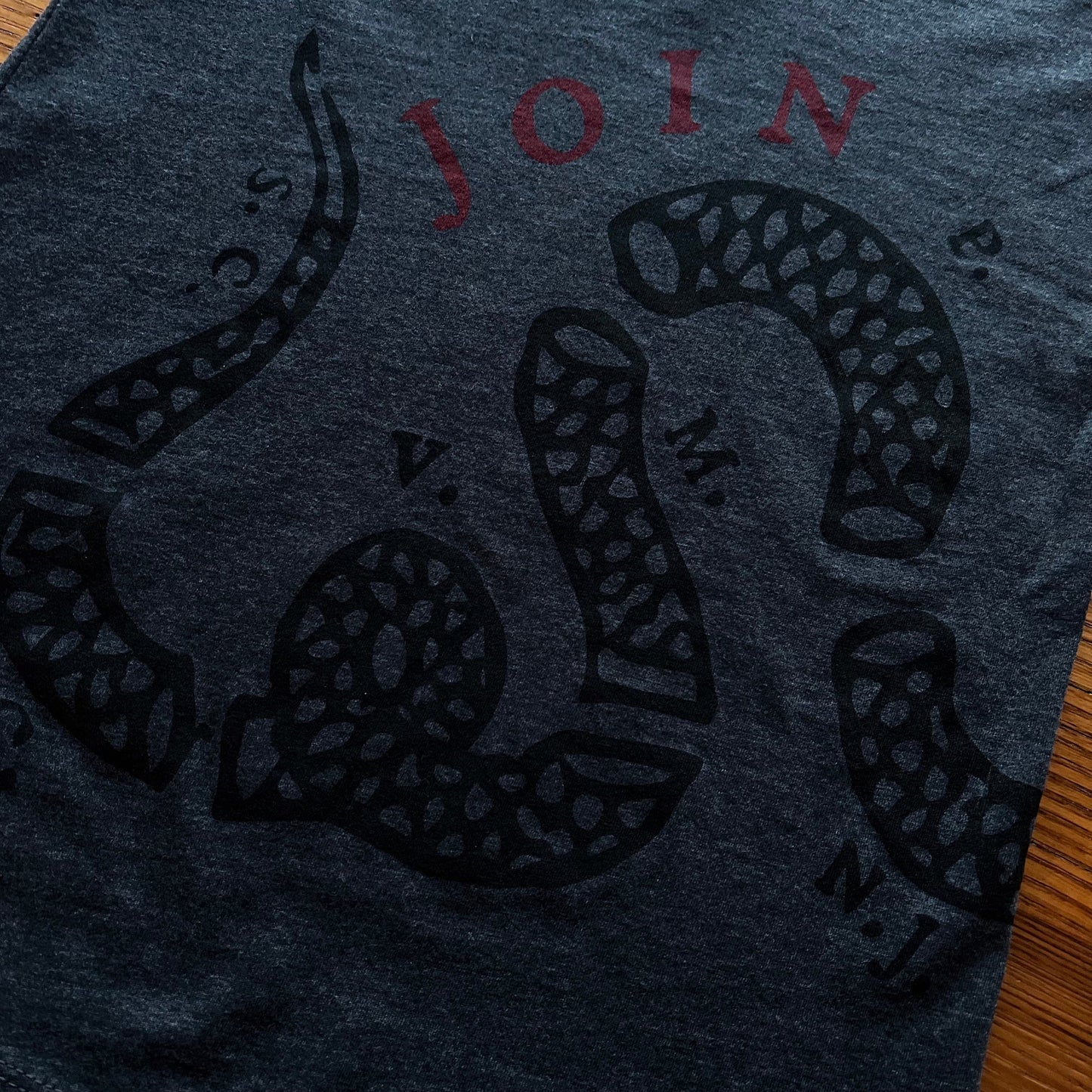 Close-up front of "Join or Die" V-neck shirt - Charcoal grey from the history list store