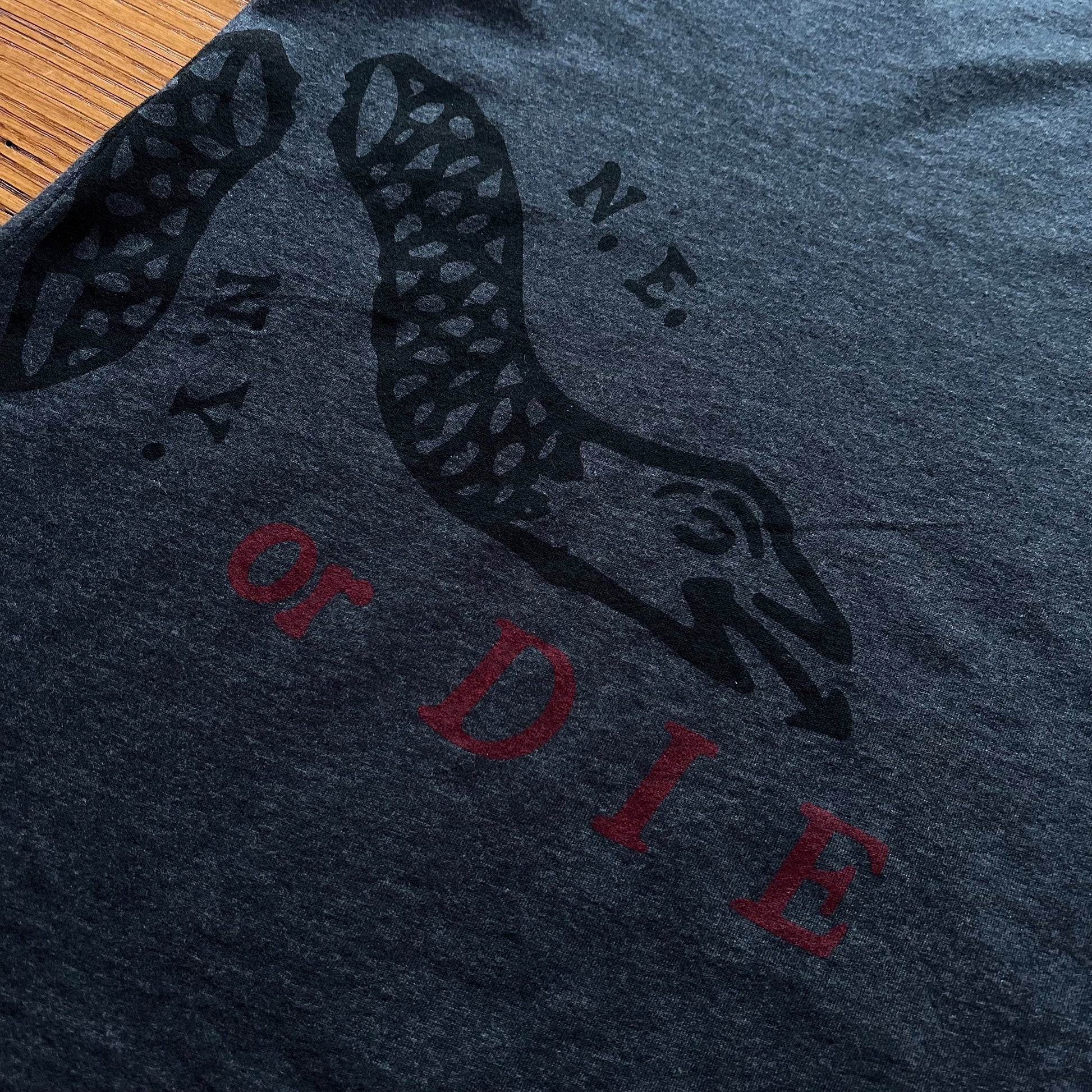 Close-up back of "Join or Die" V-neck shirt - Charcoal grey from the history list store