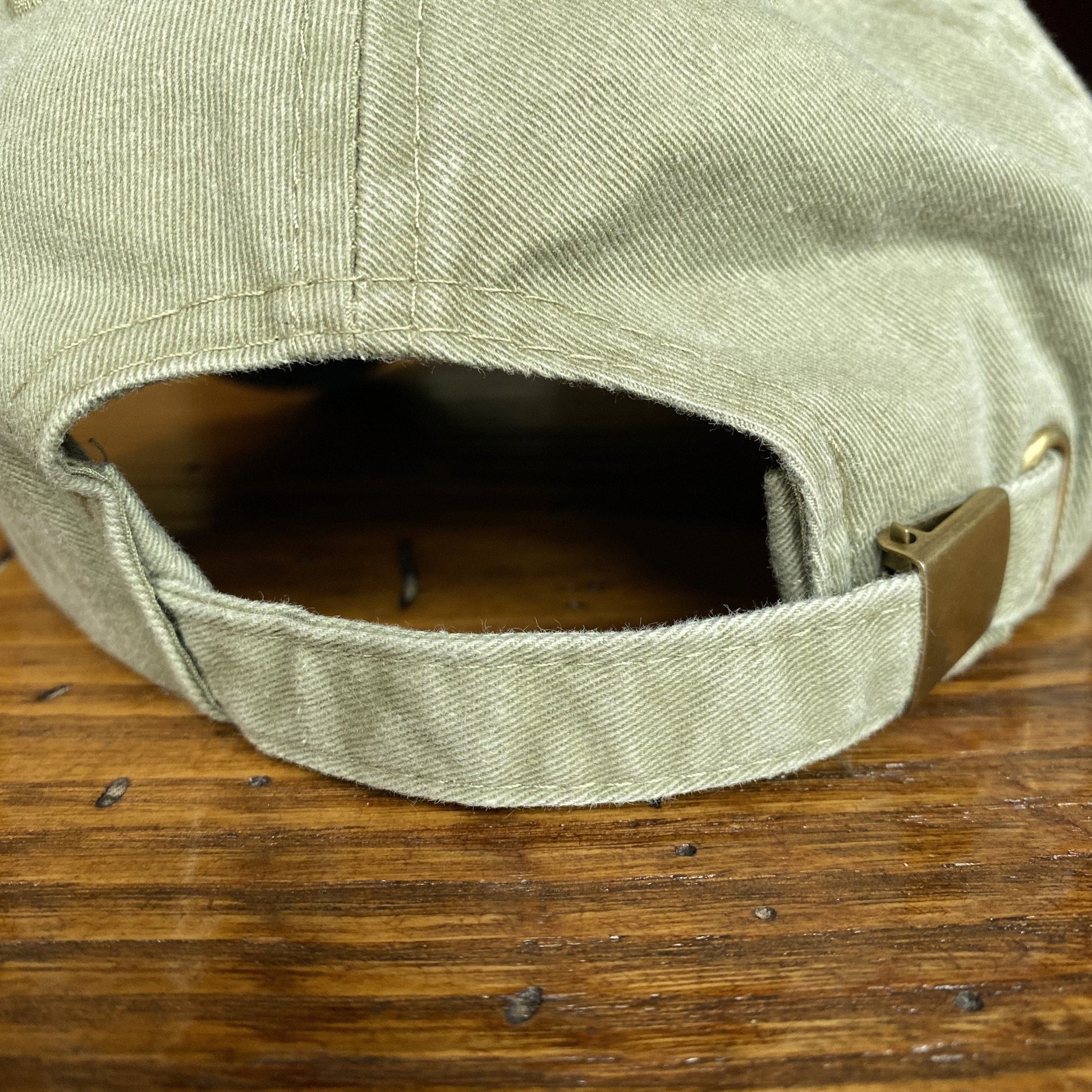 Back Closure of the Embroidered "1773" Boston Tea Party Two-tone cap - Khaki/Navy from The History List Store.