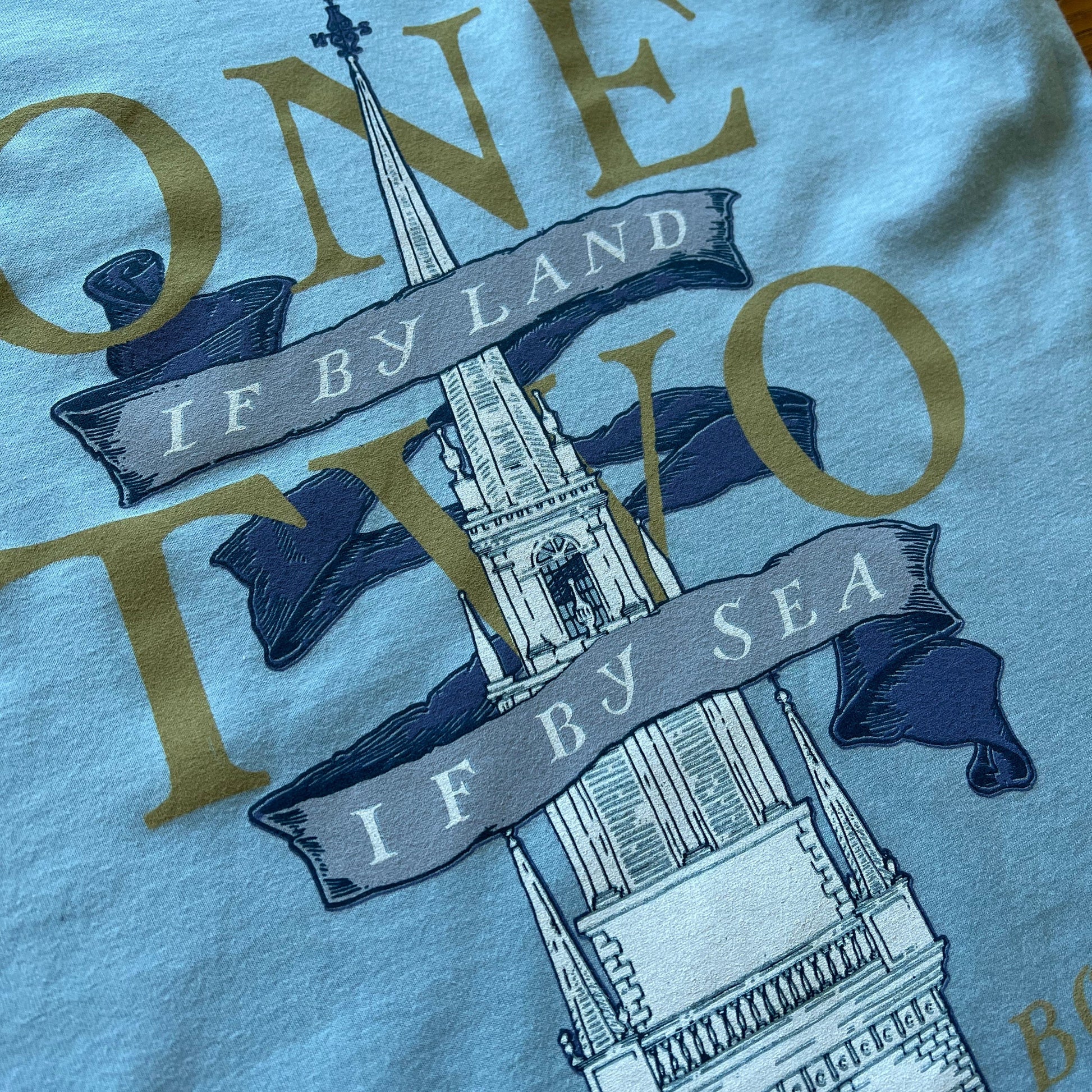 Close-up of Light blue "One if by land . . ." Old North Special Edition Women's v-neck shirt from the history list store