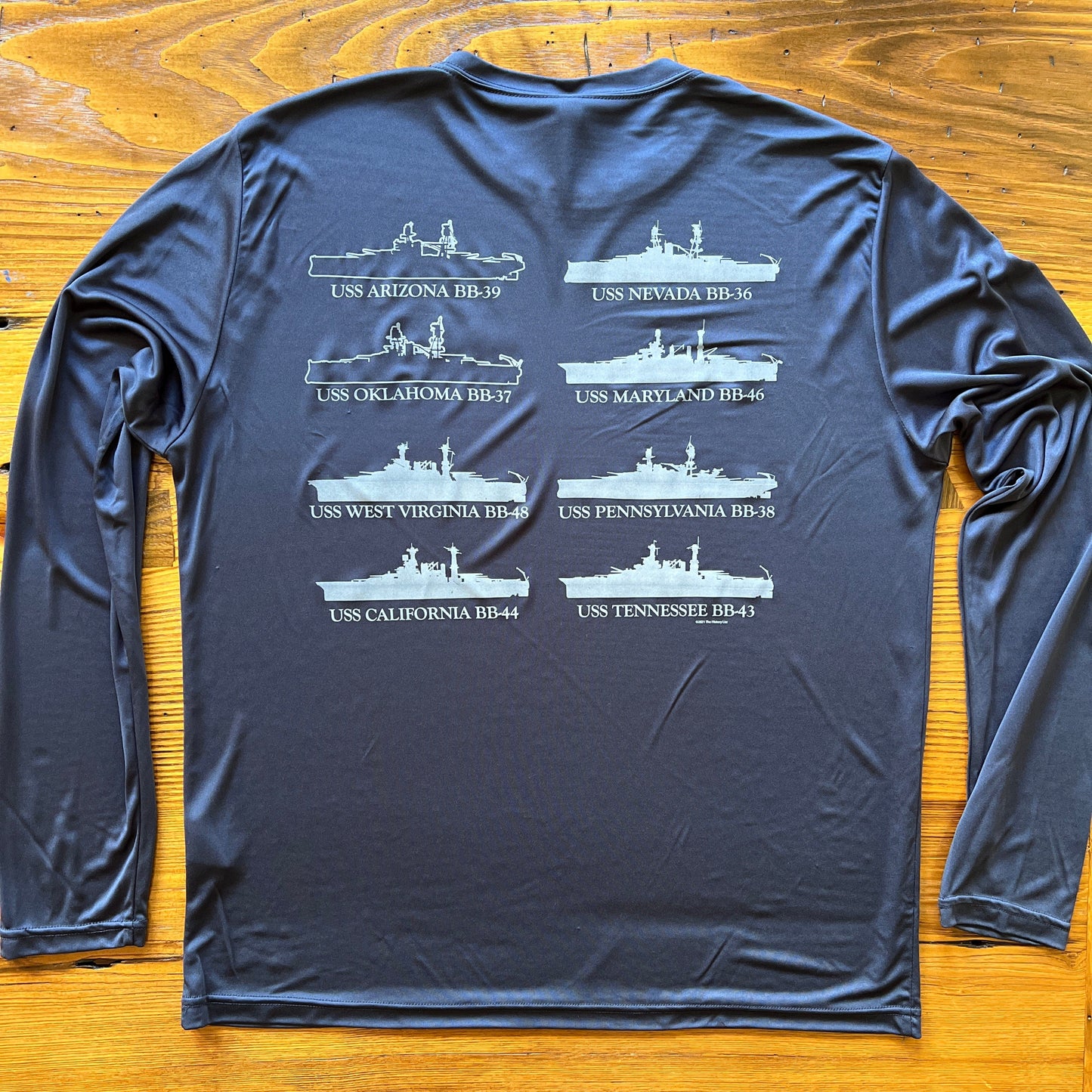 Back of the Pearl Harbor “Battleship Row” on moisture-wicking 100% polyester interlock with SPF 40+ UV protection - Long-sleeve from the History List Store