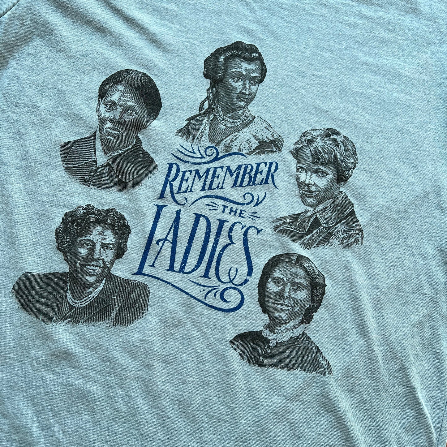 Close-up of "Remember the Ladies" Shirt — Circular design from The History List store in Light blue heather