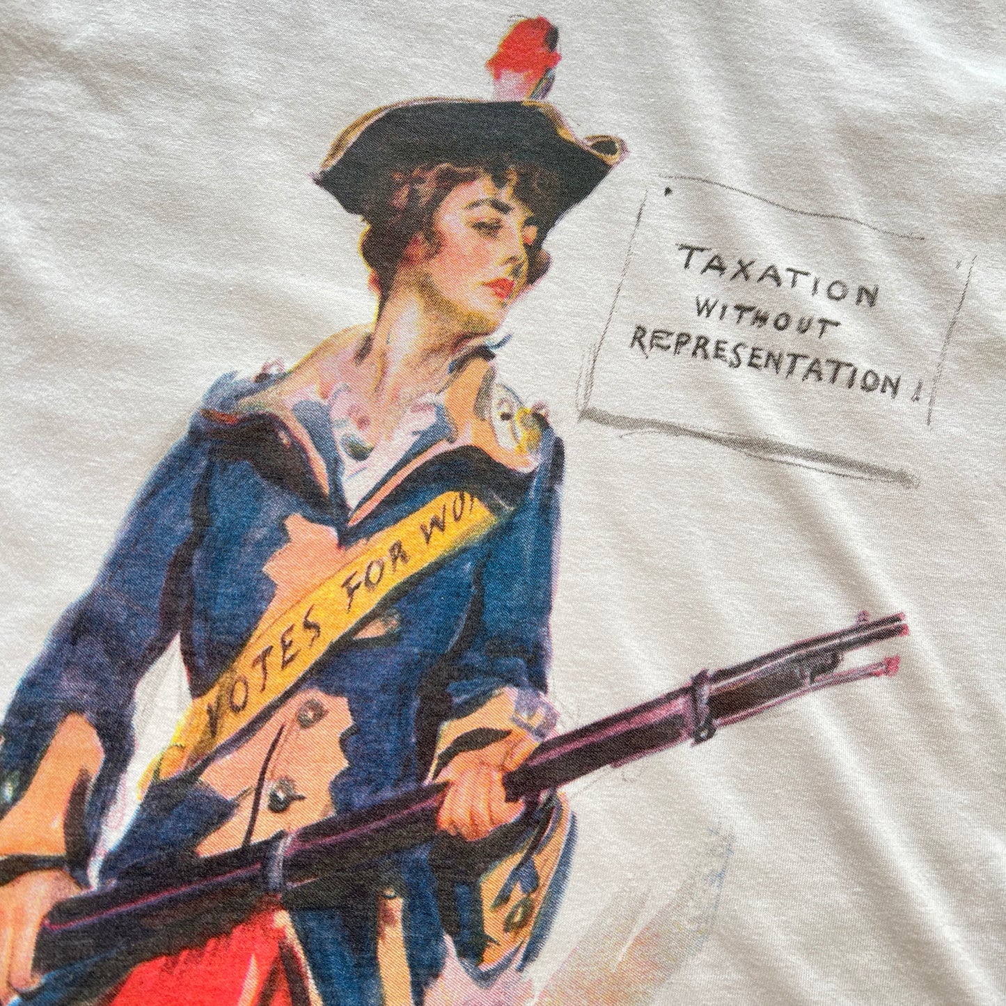 Close-up of Revolutionary Suffragette Shirt with illustration by James Montgomery Flagg V-neck shirt from The History List store