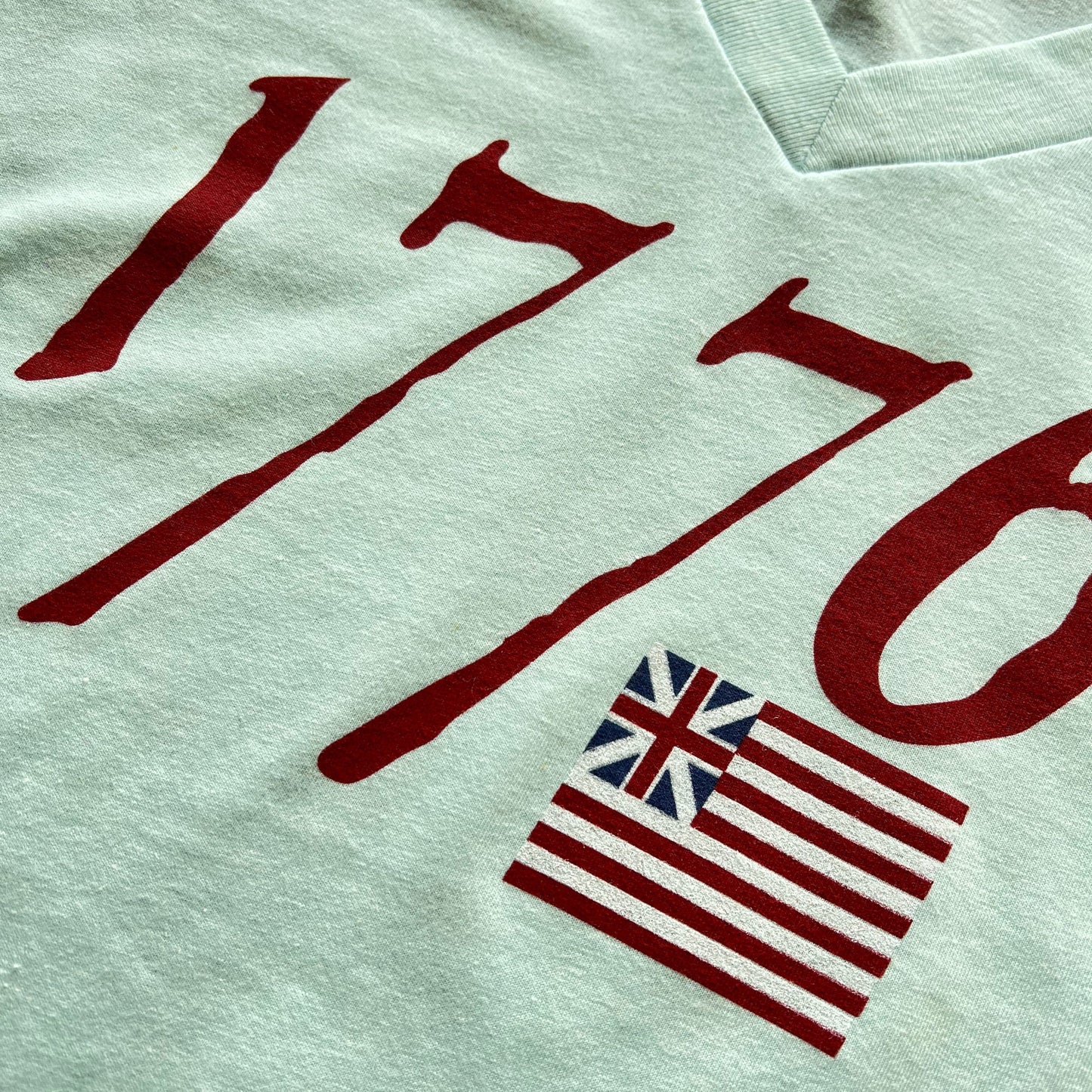 Close-up of "We hold these truths - July 4, 1776” v-neck shirt from The History List store in Light blue